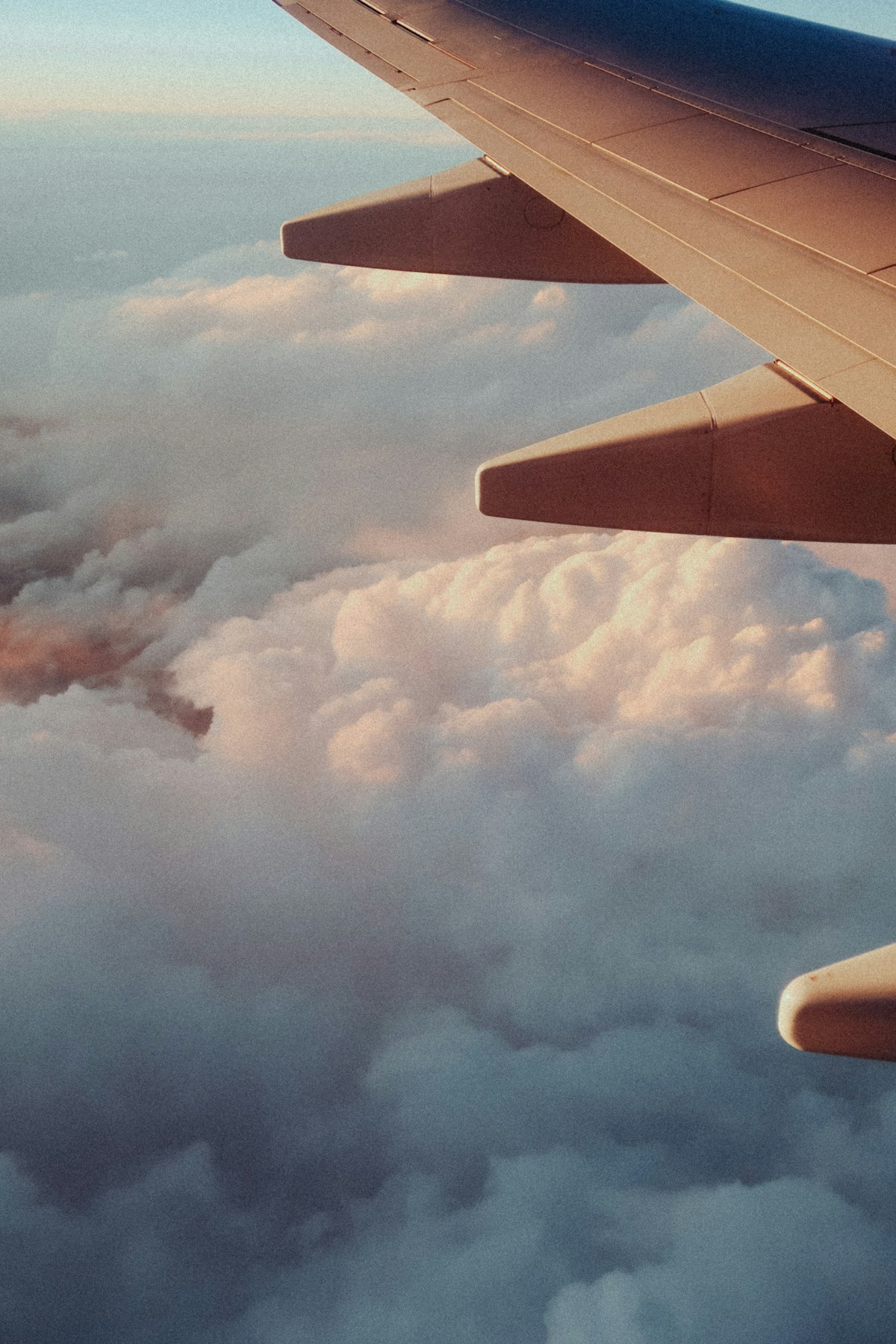 Travel documents beside an aircraft window